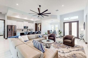 TV, fireplace, offices - Luxury canal front home with heated pool, pool spa, grill, fireplace, W/D, & AC (Cape Coral)