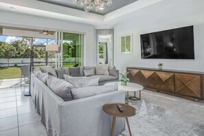 TV, offices - Contemporary Getaway with an Enclosed Yard, Fast WiFi, & Furnished Lanai (Bonita Springs)