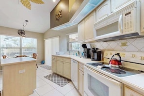 Fridge, microwave, oven, stovetop - Snowbird-friendly home with lanai, private pool, & canal access (Cape Coral)