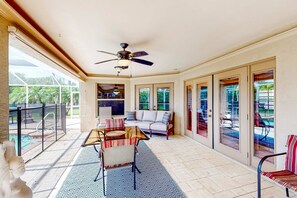 Outdoor dining - Inviting home with pool, water view, enclosed yard, central AC, W/D (Cape Coral)