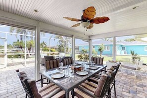 Outdoor dining - Canal-front home with screened pool, dock access, patio, grill, AC, & W/D (Cape Coral)