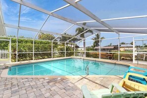 Pool - Canal-front home with screened pool, dock access, patio, grill, AC, & W/D (Cape Coral)