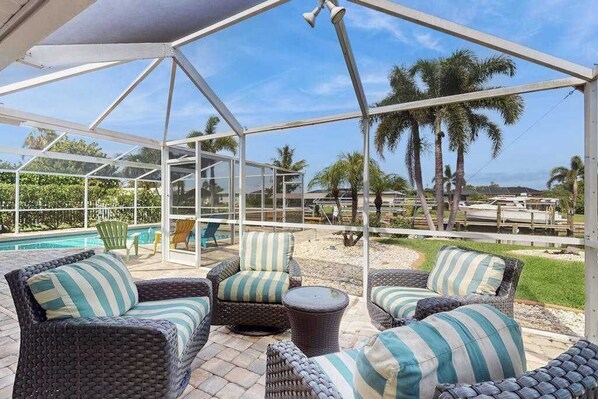 Terrace/patio - Canal-front home with screened pool, dock access, patio, grill, AC, & W/D (Cape Coral)