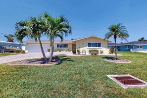 Exterior - Canal-front home with screened pool, dock access, patio, grill, AC, & W/D (Cape Coral)