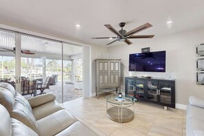 TV, offices - Canal-front home with screened pool, dock access, patio, grill, AC, & W/D (Cape Coral)
