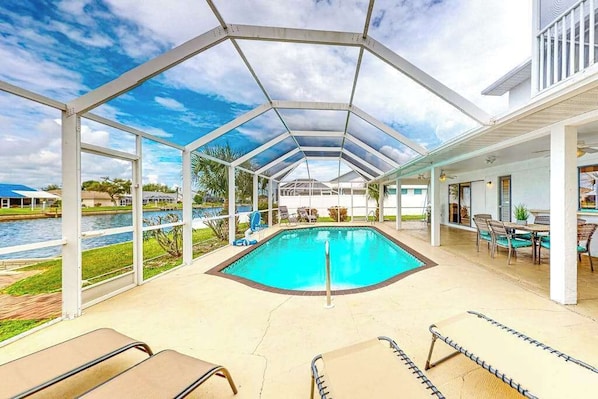 Pool - Water-view home with enclosed private pool, grill, scenic balcony, AC & W/D (Cape Coral)