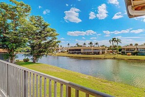 Property grounds - Waterfront condo with balcony, pool, pickball/tennis, & walking paths (Fort Myers)