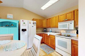 Fridge, microwave, oven, stovetop - Riverfront Getaway w/ Pool, Game Room & Snowbird Appeal – 30-Day Stay Required (Port Charlotte)