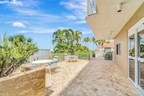 Outdoor dining - Waterfront condo with private beach area, pool, hot tub, grills, & balcony (Fort Myers)