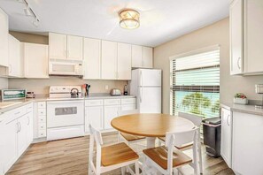 Fridge, microwave, oven, stovetop - Bayfront condo with shared pool, dock, & water views - snowbird-friendly (Marco Island)