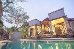 A poolside villa with a clear view of the pool, a covered patio, and a staircase leading to the entrance. - private 4-bedroom villa with Infinity pool in peaceful Ubud (ubud)