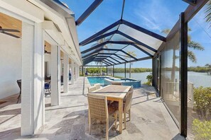 Outdoor dining - Spacious canal front home with private pool, dock & close to everything (Marco Island)