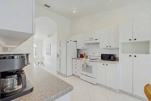 Fridge, microwave, oven, stovetop - Coastal home with pool, lanai, and washer and dryer (Marco Island)