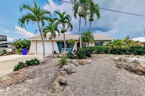 Property grounds - Private home on the canal with dock, screened pool, patio, AC, & W/D - dog-friendly (Saint James City)