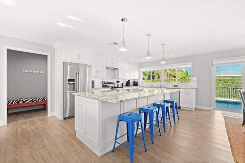 Snowbird-friendly home near water with private heated pool, grill, patio, & W/D