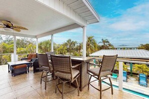 Outdoor dining - Spacious home with heated pool, lots of outdoor entertainment, and WIFI (Fort Myers Beach)