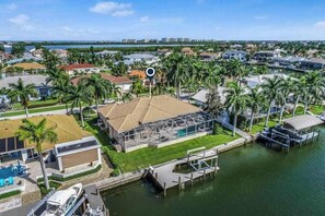 Exterior - Waterfront home with saltwater pool, pool spa, central AC, W/D, & office space (Marco Island)