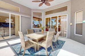 Outdoor dining - Waterfront home with saltwater pool, pool spa, central AC, W/D, & office space (Marco Island)