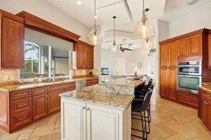 Fridge, microwave, oven, stovetop - Large corner lot home with canal views & screened in pool - close to the beach (Marco Island)