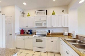 Fridge, microwave, oven, stovetop - Lakefront condo with pool, tennis, lake views, grill, patio, W/D, fast WiFi & AC (Naples)