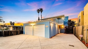 A modern two-story house with a garage, a balcony, and a wooden fence. - 25% Off Sept WkDays Great 4 Families, Walk 2 Beach (Ventura)