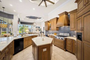 Fridge, microwave, oven, stovetop - Luxe home near the water with private heated pool, pool spa, grill, firepit, AC (Marco Island)