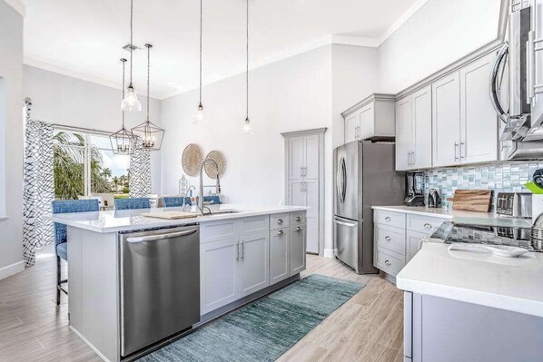 Fridge, microwave, oven, stovetop - Modern, canal-front home with amazing views, private pool, central AC, fast WiFi (Marco Island)