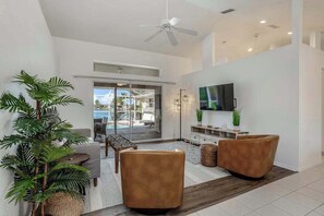 TV, offices - Riverfront, dog-friendly home with private pool & fast WiFi (Port Charlotte)