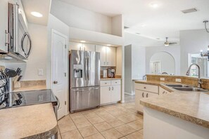 Fridge, microwave, oven, stovetop - Dog-friendly home with private heated pool, grill, A/C, & washer/dryer (Port Charlotte)