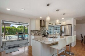 Fridge, microwave, oven, stovetop - Inviting retreat with a large yard, heated pool, firepit, games & modern charm (Naples)