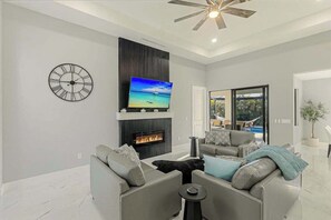 TV, offices - Canal front home with saltwater pool, hot tub, and washer and dryer. (Cape Coral)