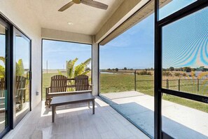 Terrace/patio - Lakefront lanai living w/ fenced yard, fishing, 10 mins to Gasparilla, Dogs OK (Placida)