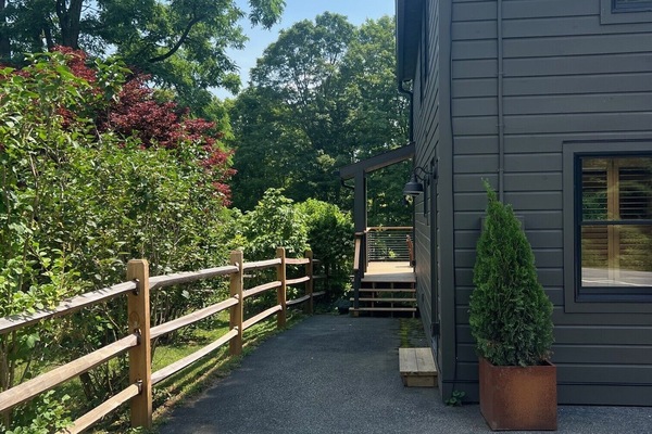 Stairs to the deck and entrance to the home. (Main Home).