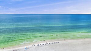 A beach with clear blue water and a sandy shore. - Two-Story penthouse with stunning Gulf views (Miramar Beach)