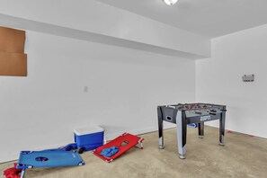 Your private game room awaits with foosball table and cornhole sets - perfect for friendly competitions and memorable moments with family. - Sound Views, Ocean Peeks + 2 Living Areas | Dogs OK | Walk to Beach (Emerald Isle)