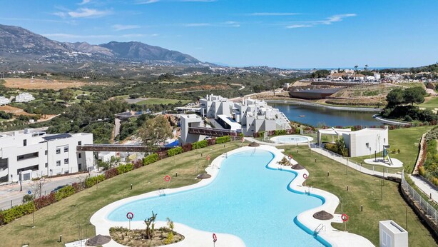 A modern hotel with a swimming pool, a view of the surrounding landscape, and a body of water. - The Don | Terrace - Views - Pool (La Cala de Mijas)
