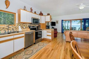 Fridge, microwave, oven, stovetop - Dog-friendly home with lake views, wood stove, kayaks/SUPs, & W/D (Coloma)