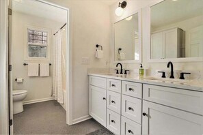 Shower, towels - Modern Lake Michigan home with wood fireplace, open layout, deck, W/D, & AC (Fennville)