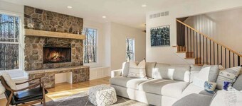 Modern Lake Michigan home with wood fireplace, open layout, deck, W/D, & AC