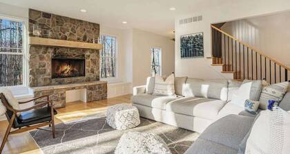Modern Lake Michigan home with wood fireplace, open layout, deck, W/D, & AC