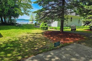 Property grounds - Dog-friendly and lakefront home with firepit close to restaurants and shops (Honor)