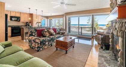 Lakefront condo with deck, gorgeous view, fireplace, & W/D
