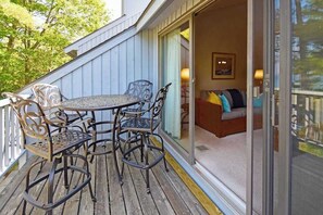 Outdoor dining - Beachfront condo with beach access, fireplace, balcony, washer/dryer & views (Glen Arbor)
