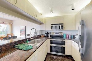 Fridge, microwave, oven, stovetop - Sunny upper-level beachfront condo with Lake Michigan views, fireplace, deck (Glen Arbor)