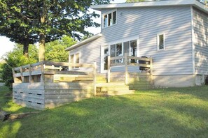 Exterior - Lakefront cottage with a deck, grill, firepit, dock & partial AC (Glen Arbor)