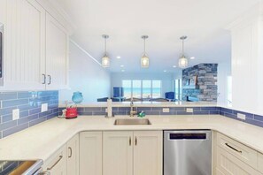 Fridge, microwave, oven, stovetop - Lower-level beachfront condo with deck, fireplace, washer/dryer, central AC (Glen Arbor)