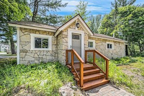 Exterior - Stone home two blocks from the lake & downtown with gas grill & free WiFi (Boyne City)