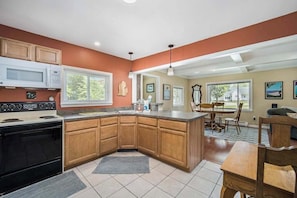 Fridge, microwave, oven, stovetop - Stone home two blocks from the lake & downtown with gas grill & free WiFi (Boyne City)