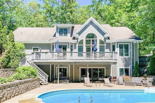 Airy home with private pool, hot tub, big game room, & golf cart - walk to beach