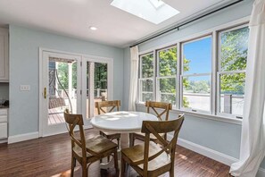 Dining - Serene lakefront retreat with an expansive deck, dock access, game room, & AC (Berrien Springs)